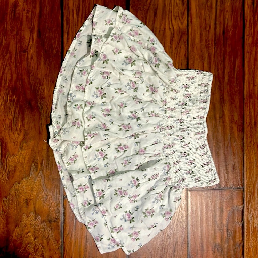 This is a white and floral Hollister skirt.
